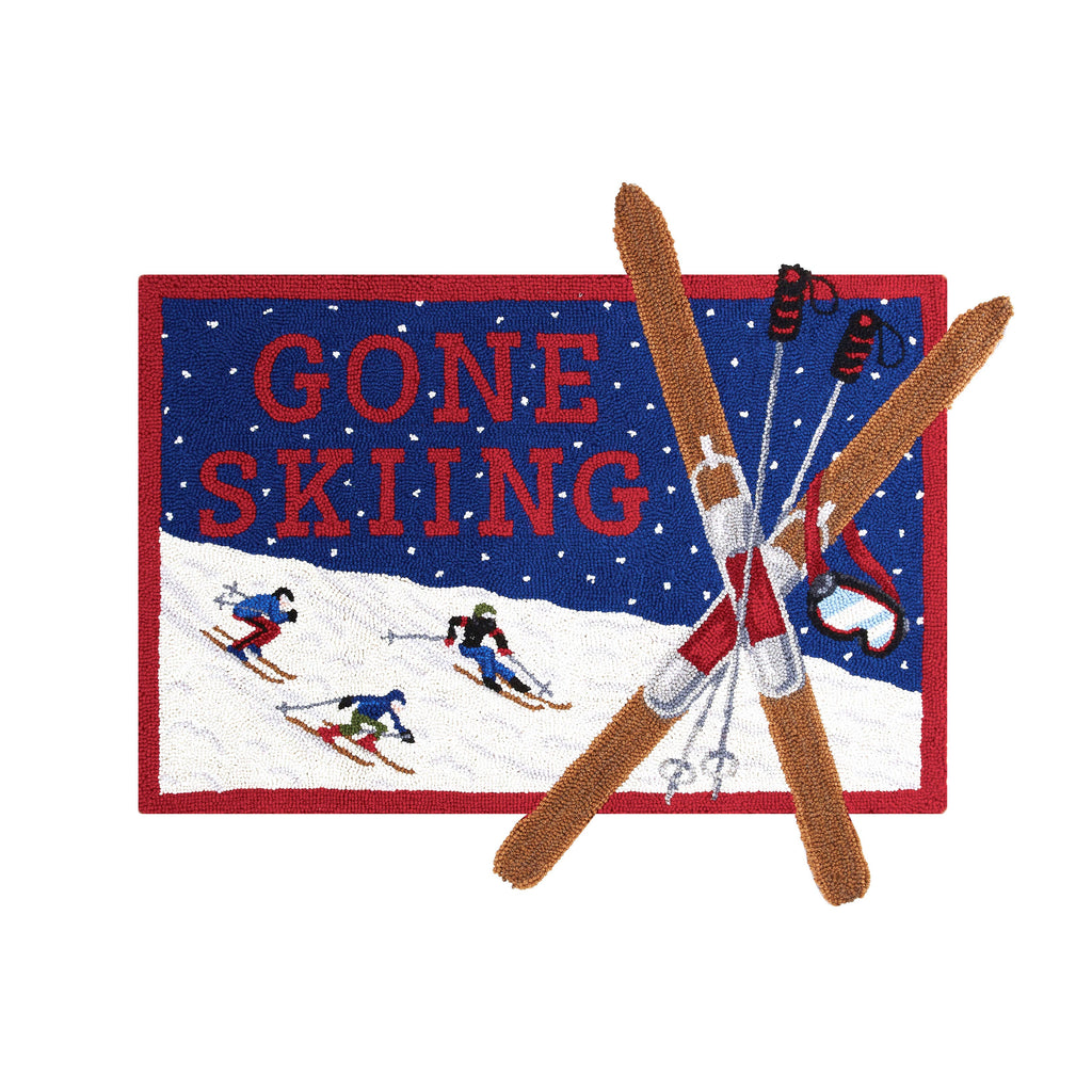 Embroidered patch with 'Gone Skiing' text and skiers on a blue background.
