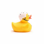 Yellow rubber duck with a helmet on a white background
