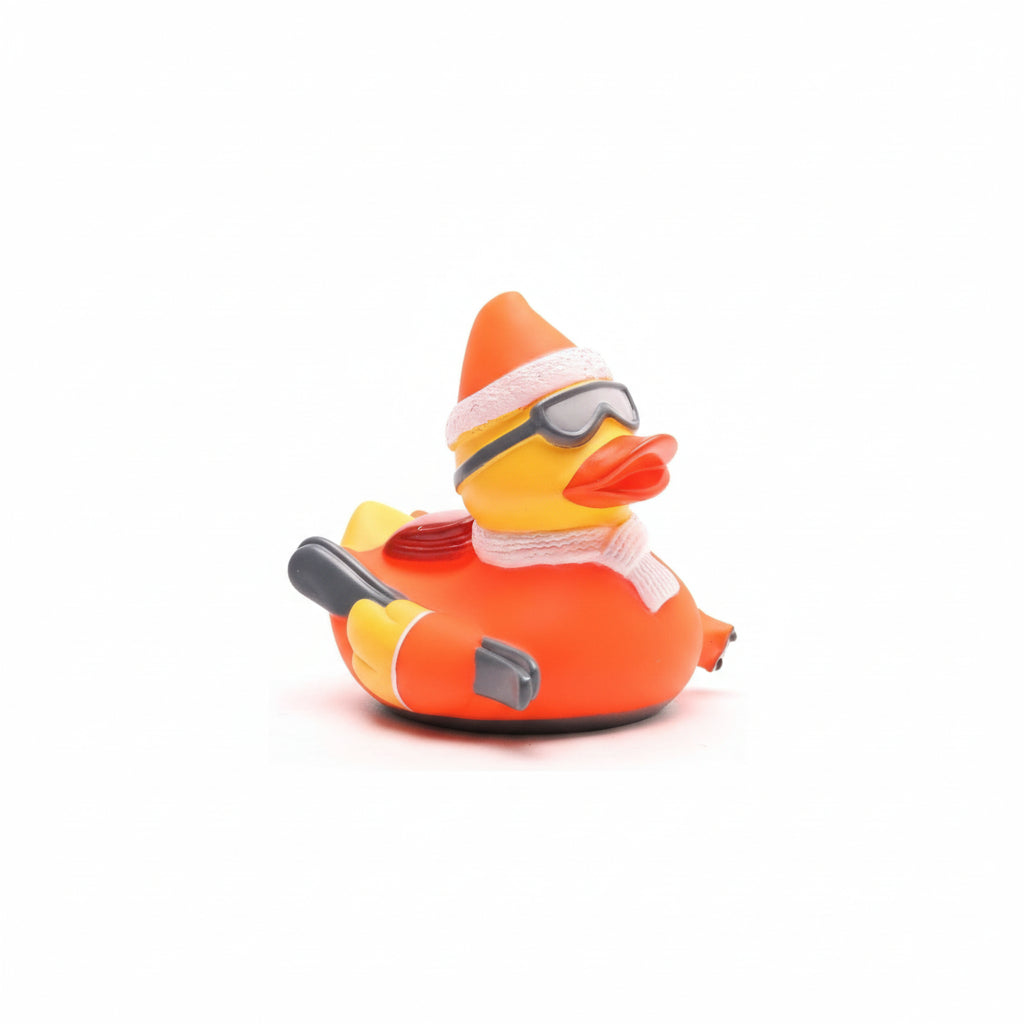 Rubber duck dressed in orange winter gear with goggles and scarf on a white background