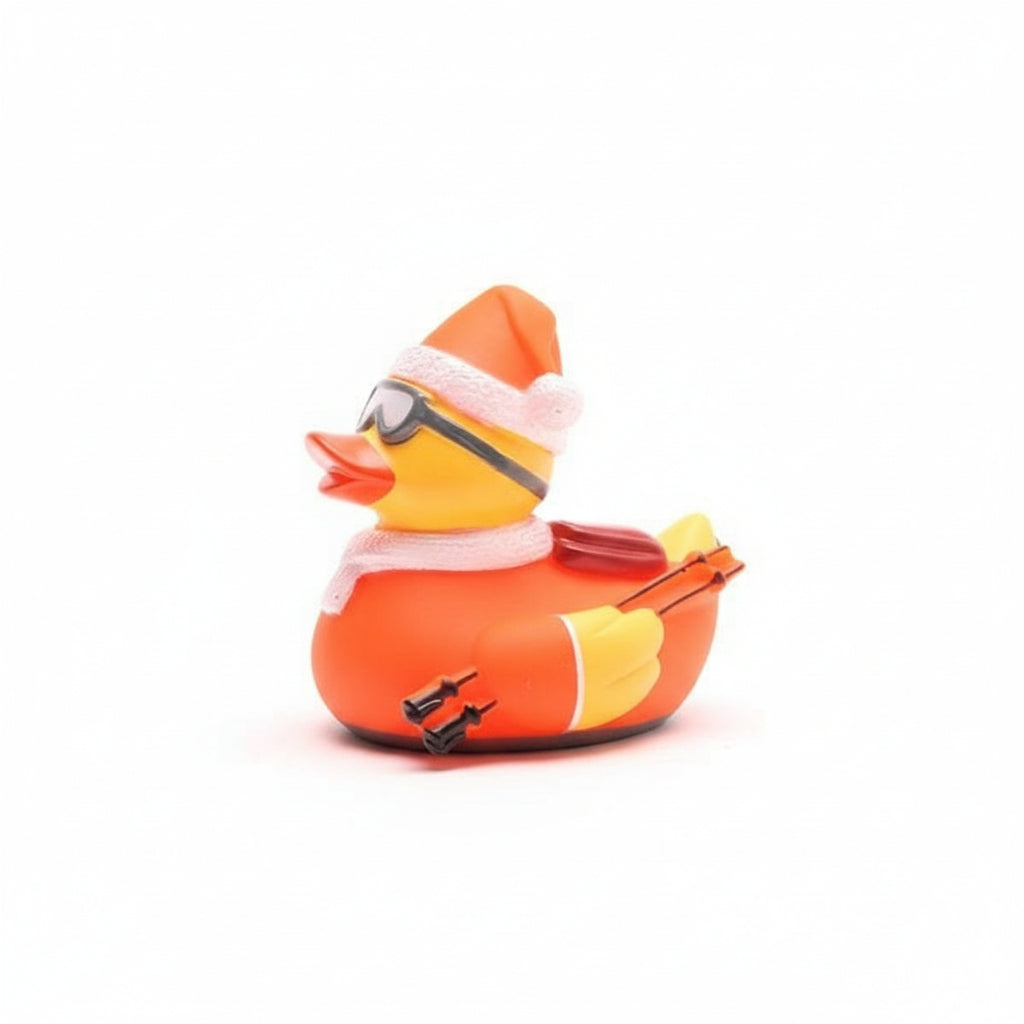 Rubber duck with Santa hat, goggles, and skis on a white background
