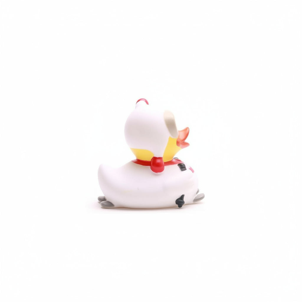 White cat figurine with colorful bow tie on a white background
