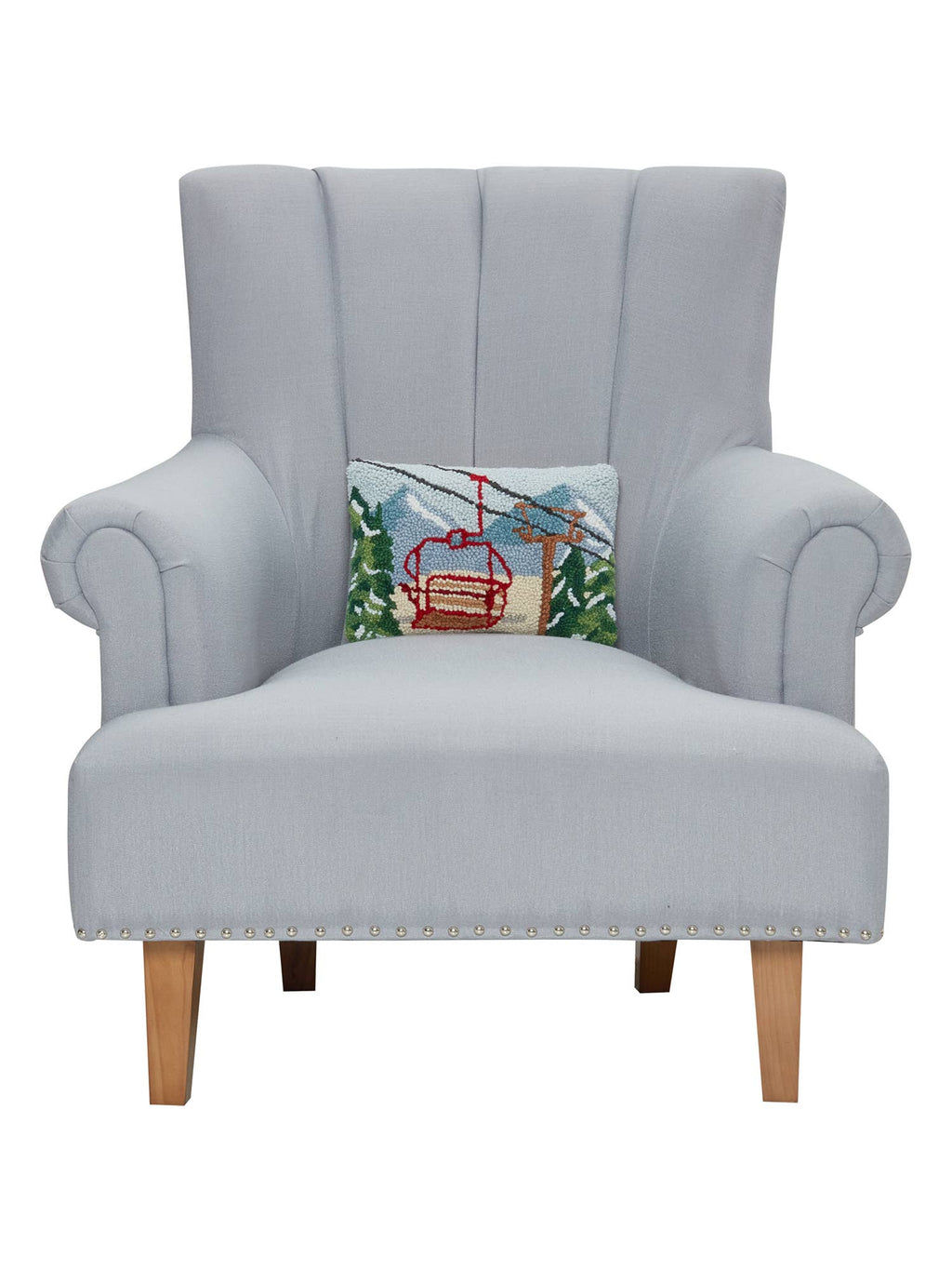 Gray armchair with a decorative pillow featuring a ski lift on a white background