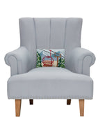 Gray armchair with a decorative pillow featuring a ski lift on a white background