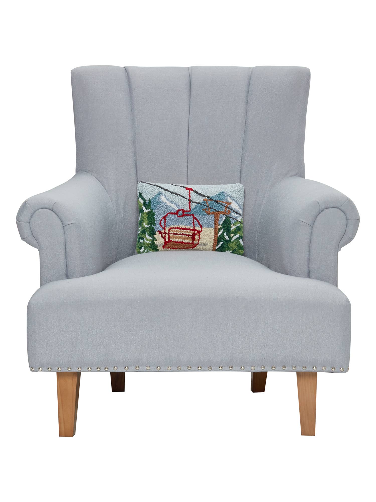 Gray armchair with a decorative pillow featuring a ski lift on a white background